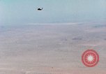Image of Firebee drone suspended from CH-3 Sea King helicopter California United States USA, 1971, second 20 stock footage video 65675067709