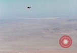 Image of Firebee drone suspended from CH-3 Sea King helicopter California United States USA, 1971, second 22 stock footage video 65675067709