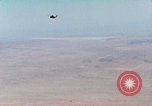 Image of Firebee drone suspended from CH-3 Sea King helicopter California United States USA, 1971, second 23 stock footage video 65675067709