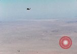 Image of Firebee drone suspended from CH-3 Sea King helicopter California United States USA, 1971, second 24 stock footage video 65675067709