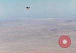 Image of Firebee drone suspended from CH-3 Sea King helicopter California United States USA, 1971, second 26 stock footage video 65675067709