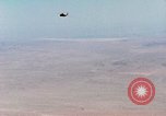 Image of Firebee drone suspended from CH-3 Sea King helicopter California United States USA, 1971, second 27 stock footage video 65675067709