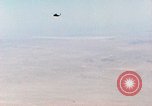 Image of Firebee drone suspended from CH-3 Sea King helicopter California United States USA, 1971, second 28 stock footage video 65675067709