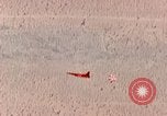 Image of Firebee drone suspended from CH-3 Sea King helicopter California United States USA, 1971, second 32 stock footage video 65675067709