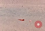 Image of Firebee drone suspended from CH-3 Sea King helicopter California United States USA, 1971, second 33 stock footage video 65675067709