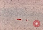 Image of Firebee drone suspended from CH-3 Sea King helicopter California United States USA, 1971, second 34 stock footage video 65675067709