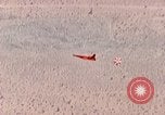 Image of Firebee drone suspended from CH-3 Sea King helicopter California United States USA, 1971, second 36 stock footage video 65675067709