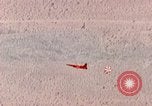 Image of Firebee drone suspended from CH-3 Sea King helicopter California United States USA, 1971, second 37 stock footage video 65675067709