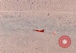 Image of Firebee drone suspended from CH-3 Sea King helicopter California United States USA, 1971, second 44 stock footage video 65675067709