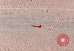 Image of Firebee drone suspended from CH-3 Sea King helicopter California United States USA, 1971, second 45 stock footage video 65675067709