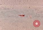 Image of Firebee drone suspended from CH-3 Sea King helicopter California United States USA, 1971, second 47 stock footage video 65675067709