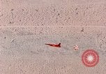 Image of Firebee drone suspended from CH-3 Sea King helicopter California United States USA, 1971, second 51 stock footage video 65675067709