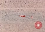 Image of Firebee drone suspended from CH-3 Sea King helicopter California United States USA, 1971, second 52 stock footage video 65675067709