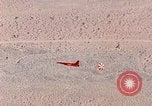Image of Firebee drone suspended from CH-3 Sea King helicopter California United States USA, 1971, second 53 stock footage video 65675067709
