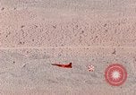Image of Firebee drone suspended from CH-3 Sea King helicopter California United States USA, 1971, second 55 stock footage video 65675067709