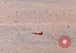 Image of Firebee drone suspended from CH-3 Sea King helicopter California United States USA, 1971, second 56 stock footage video 65675067709