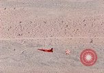 Image of Firebee drone suspended from CH-3 Sea King helicopter California United States USA, 1971, second 57 stock footage video 65675067709