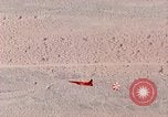 Image of Firebee drone suspended from CH-3 Sea King helicopter California United States USA, 1971, second 58 stock footage video 65675067709