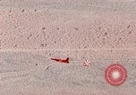 Image of Firebee drone suspended from CH-3 Sea King helicopter California United States USA, 1971, second 61 stock footage video 65675067709
