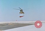 Image of CH-3 helicopter lowers BQM-34 F Firebee drone to ground California United States USA, 1971, second 17 stock footage video 65675067713