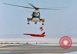 Image of CH-3 helicopter lowers BQM-34 F Firebee drone to ground California United States USA, 1971, second 30 stock footage video 65675067713