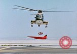 Image of CH-3 helicopter lowers BQM-34 F Firebee drone to ground California United States USA, 1971, second 31 stock footage video 65675067713