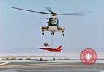 Image of CH-3 helicopter lowers BQM-34 F Firebee drone to ground California United States USA, 1971, second 32 stock footage video 65675067713