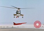 Image of CH-3 helicopter lowers BQM-34 F Firebee drone to ground California United States USA, 1971, second 43 stock footage video 65675067713