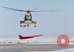 Image of CH-3 helicopter lowers BQM-34 F Firebee drone to ground California United States USA, 1971, second 44 stock footage video 65675067713