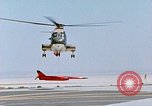 Image of CH-3 helicopter lowers BQM-34 F Firebee drone to ground California United States USA, 1971, second 47 stock footage video 65675067713