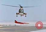 Image of CH-3 helicopter lowers BQM-34 F Firebee drone to ground California United States USA, 1971, second 49 stock footage video 65675067713