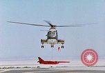Image of CH-3 helicopter lowers BQM-34 F Firebee drone to ground California United States USA, 1971, second 51 stock footage video 65675067713