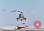 Image of CH-3 helicopter lowers BQM-34 F Firebee drone to ground California United States USA, 1971, second 56 stock footage video 65675067713