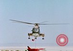 Image of CH-3 helicopter lowers BQM-34 F Firebee drone to ground California United States USA, 1971, second 59 stock footage video 65675067713