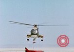 Image of CH-3 helicopter lowers BQM-34 F Firebee drone to ground California United States USA, 1971, second 61 stock footage video 65675067713