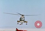 Image of CH-3 helicopter lowers BQM-34 F Firebee drone to ground California United States USA, 1971, second 62 stock footage video 65675067713