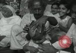 Image of people worship India, 1961, second 17 stock footage video 65675067726