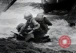 Image of American Marines landing and moving inland Guadalcanal Solomon Islands, 1942, second 40 stock footage video 65675067764
