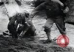 Image of American Marines landing and moving inland Guadalcanal Solomon Islands, 1942, second 42 stock footage video 65675067764