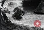 Image of American Marines landing and moving inland Guadalcanal Solomon Islands, 1942, second 43 stock footage video 65675067764