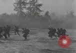Image of American Marines landing and moving inland Guadalcanal Solomon Islands, 1942, second 44 stock footage video 65675067764