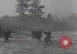 Image of American Marines landing and moving inland Guadalcanal Solomon Islands, 1942, second 45 stock footage video 65675067764