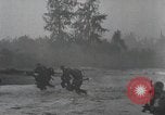 Image of American Marines landing and moving inland Guadalcanal Solomon Islands, 1942, second 46 stock footage video 65675067764