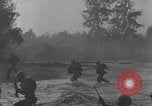 Image of American Marines landing and moving inland Guadalcanal Solomon Islands, 1942, second 50 stock footage video 65675067764