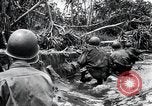 Image of American Marines landing and moving inland Guadalcanal Solomon Islands, 1942, second 60 stock footage video 65675067764