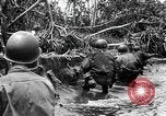 Image of American Marines landing and moving inland Guadalcanal Solomon Islands, 1942, second 61 stock footage video 65675067764