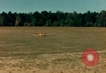 Image of Tuskagee pilot trainees practice taxiing in Piper cub airplanes Alabama United States USA, 1941, second 33 stock footage video 65675068170