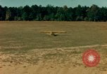 Image of Tuskagee pilot trainees practice taxiing in Piper cub airplanes Alabama United States USA, 1941, second 40 stock footage video 65675068170