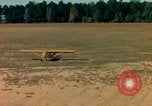 Image of Tuskagee pilot trainees practice taxiing in Piper cub airplanes Alabama United States USA, 1941, second 48 stock footage video 65675068170