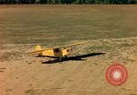 Image of Tuskagee pilot trainees practice taxiing in Piper cub airplanes Alabama United States USA, 1941, second 54 stock footage video 65675068170
